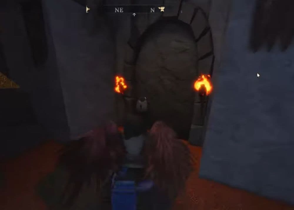 The key will open up this door you see in the image above (Image Credit: O1G on YouTube)