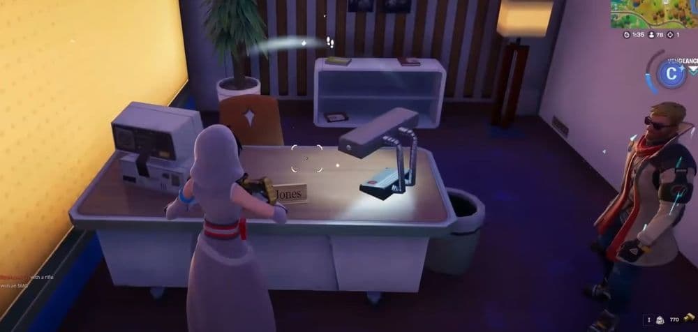 You can find the second clue on Vengeance Jones’ desk (Image Credit: Axvezer on YouTube)